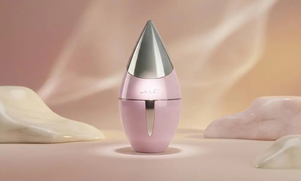Pink "LANSY" perfume bottle with silver pointed cap, centered with soft light.