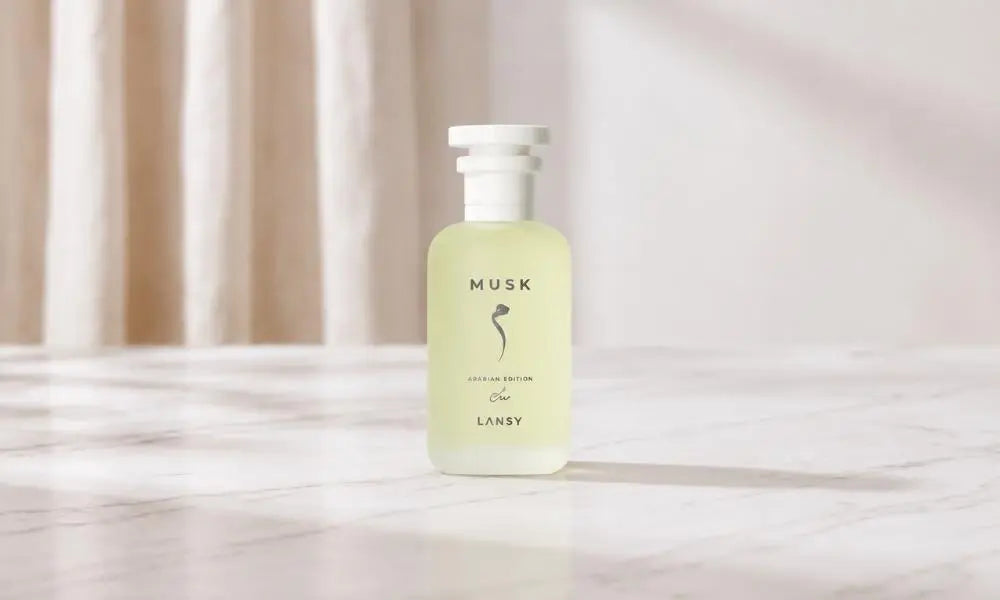 LANSY Musk Arabian Edition perfume bottle on a white marble surface in bright studio lighting.