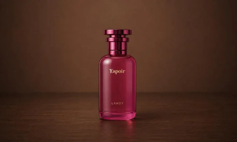 Luxury pink perfume bottle on a warm wooden surface with a soft brown background, elegant minimalist product photography.