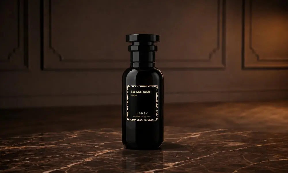 A black LANSY "LA MADAME" perfume bottle on a dark marble surface