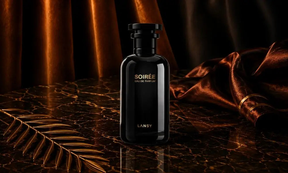 Elegant SOIRÉE Eau de Parfum bottle on dark marble with warm ambient lighting and a luxurious satin backdrop.