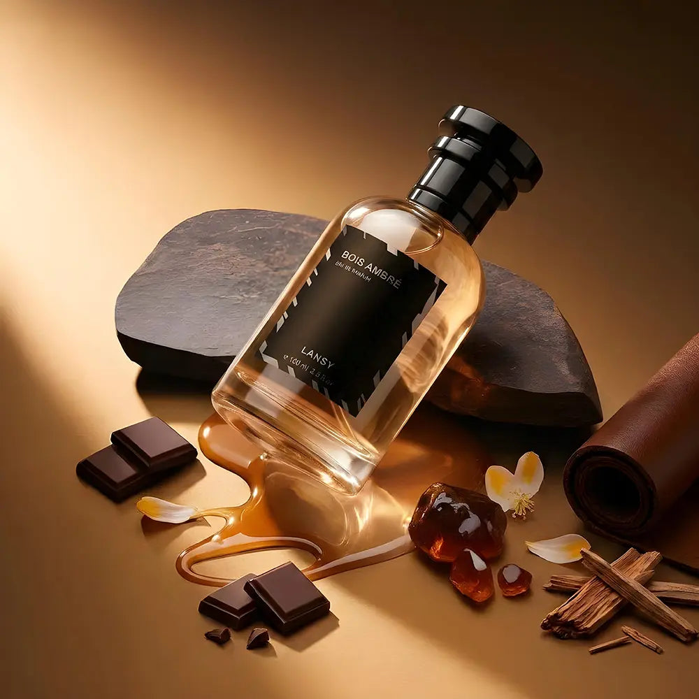 Perfume bottle with chocolate, amber, and cinnamon on a warm background