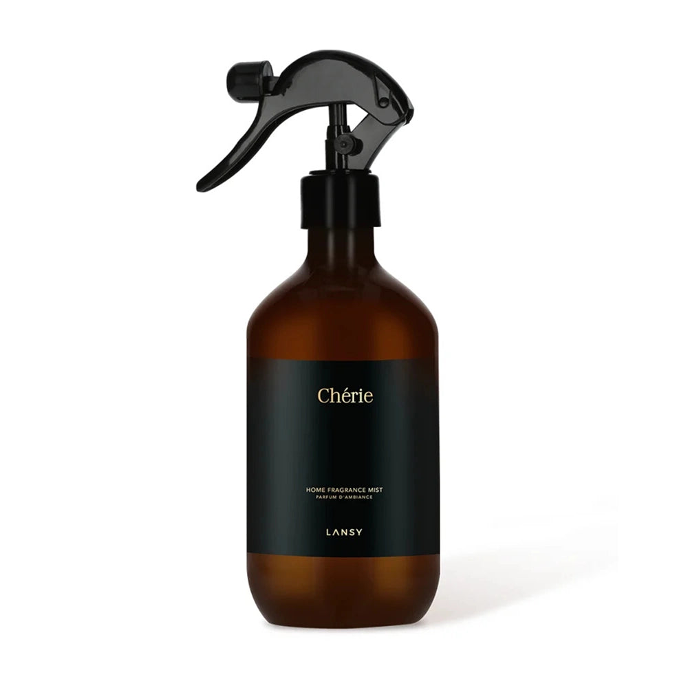 Brown spray bottle with black label on a white background