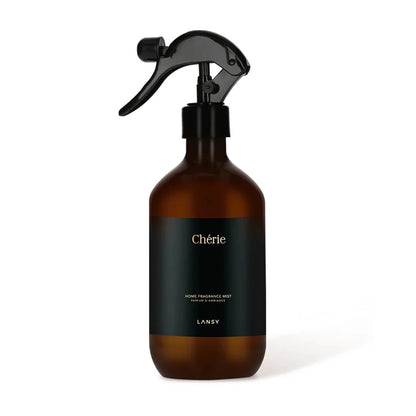 Brown spray bottle with black label on a white background
