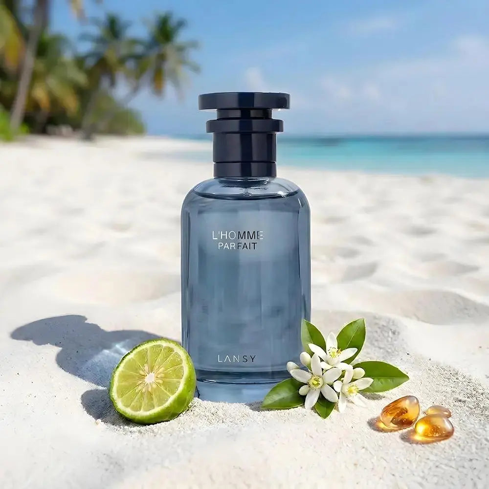 L'Homme Parfait perfume with lime, white flowers and amber on a tropical beach.
