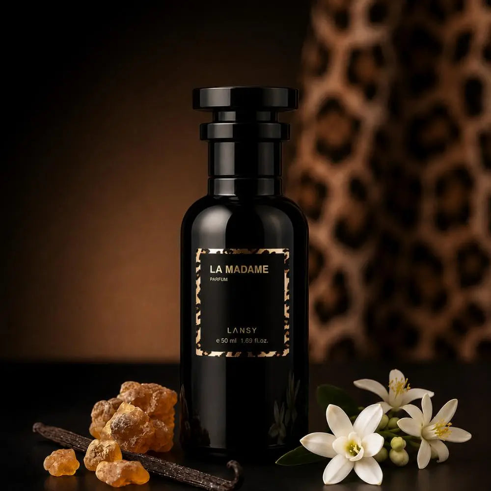 LANSY La Madame Eau de Parfum bottle with vanilla, white flowers and amber resin on a warm leopard-print background.