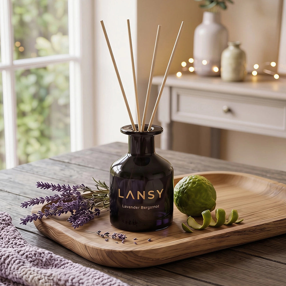 LANSY reed diffuser with lavender, lime and natural reeds on a wooden tray.