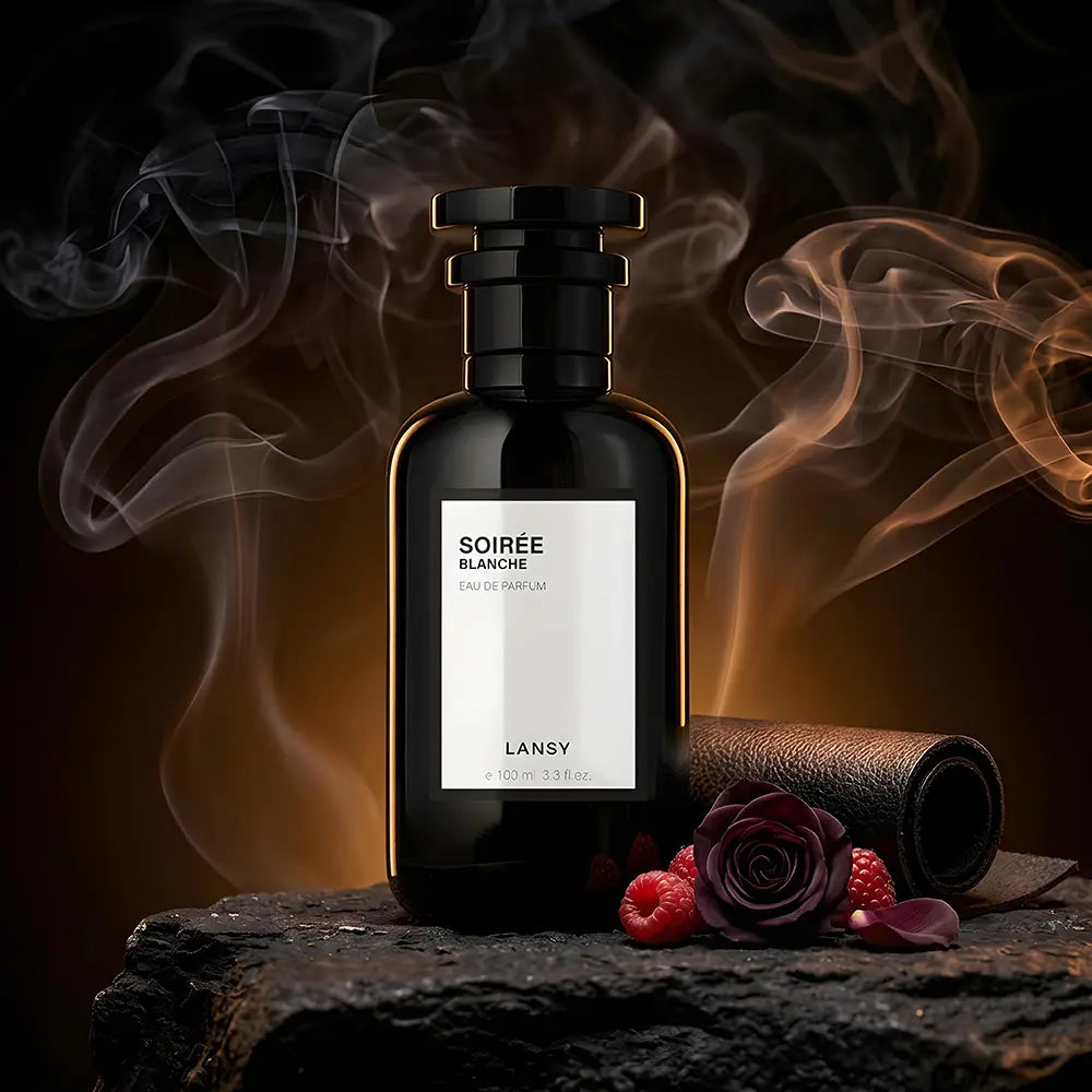 Soirée Blanche Eau de Perfume with raspberries and dark roses on a smoky black background.