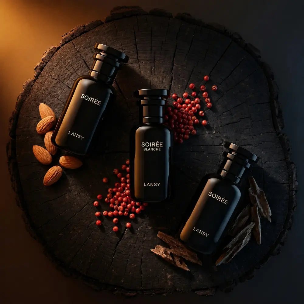 LANSY Soirée Blanche perfume bottles with almonds, red berries and cinnamon under warm lighting.