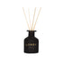 Black LANSY diffuser bottle with wooden sticks on a white background