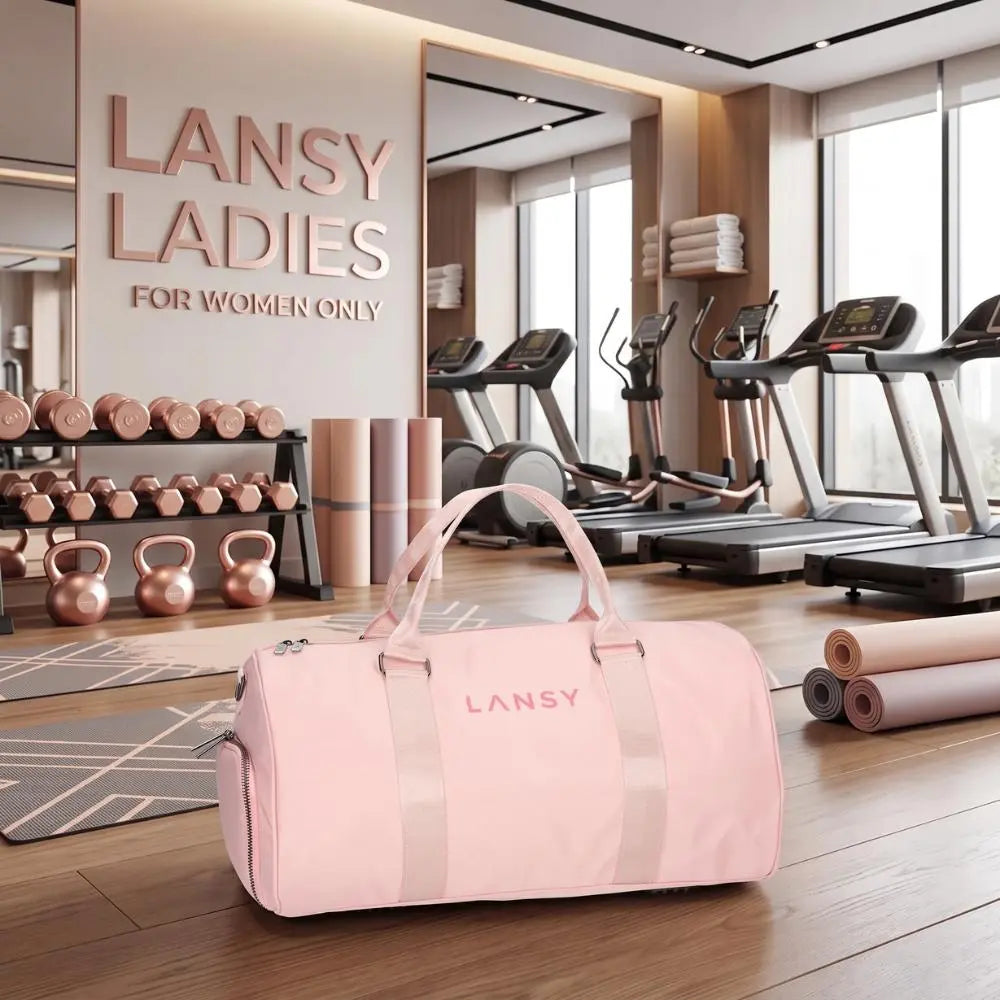 LANSY pink duffel bag on a wooden floor in a modern fitness center.