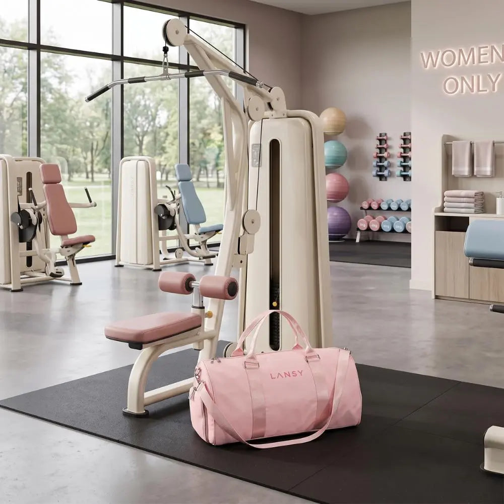 LANSY pink duffel bag with rose gold accents in a modern women's gym.