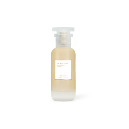 Skincare bottle with a white cap on a light beige background