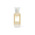 Skincare bottle with a white cap on a light beige background
