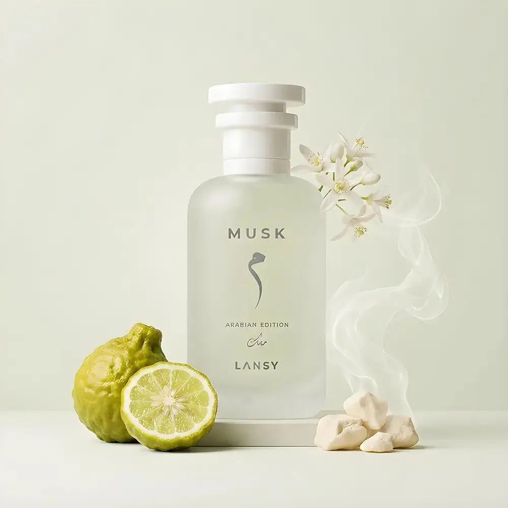 Lansy Musk perfume bottle with lemons and flowers on a light background