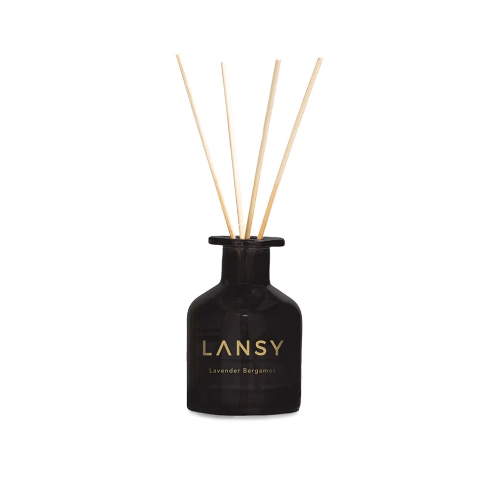 Black LANSY diffuser bottle with wooden sticks on a white background