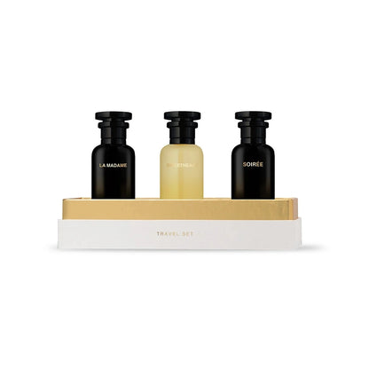 Three black and gold bottles on a white background